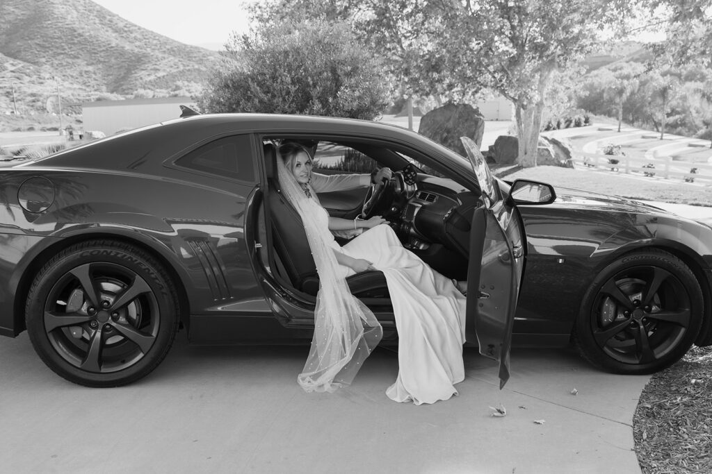 bride and groom in their camaro at their Lambs Fellowship wedding in California